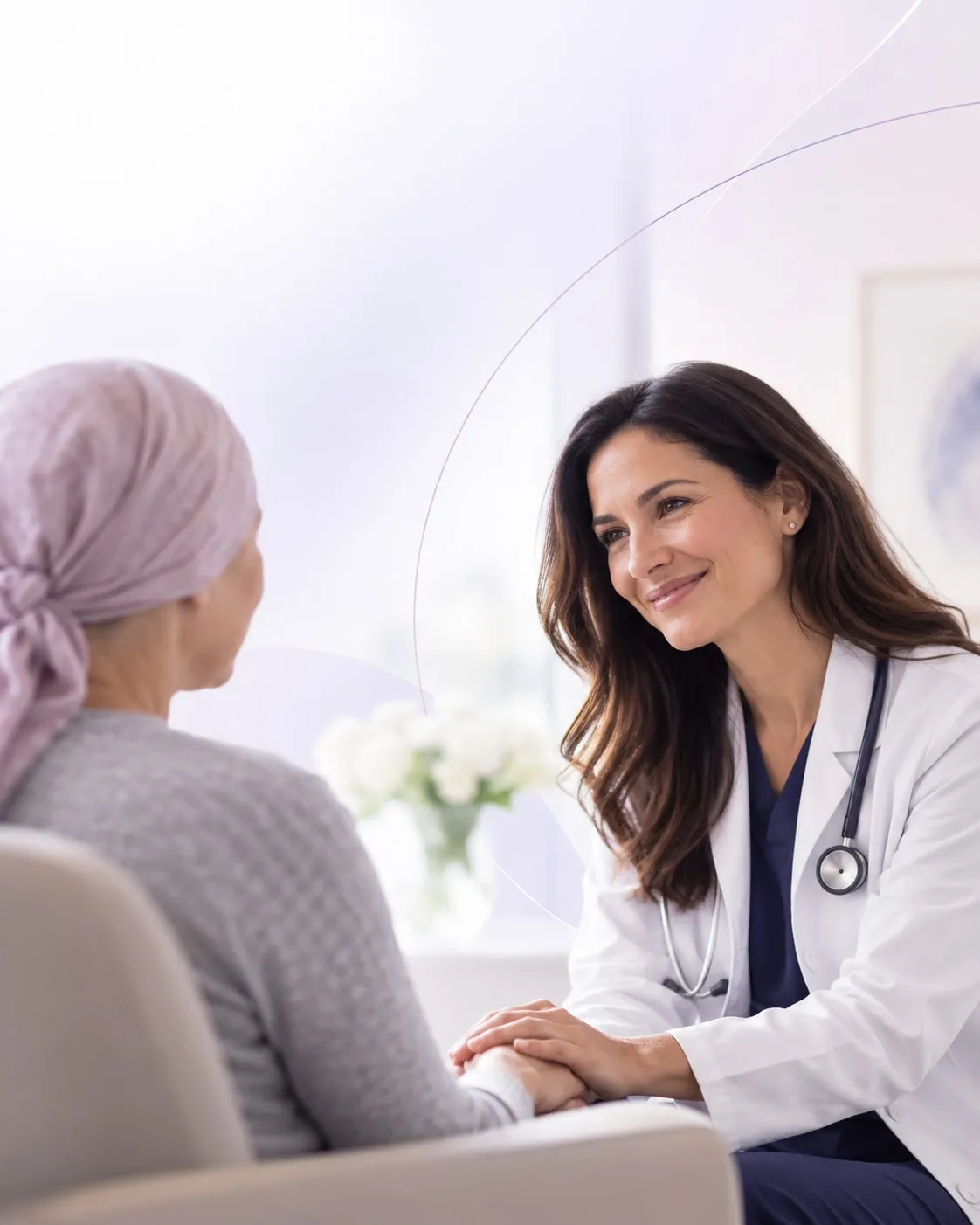 A physician sitting with a patient during a consultation